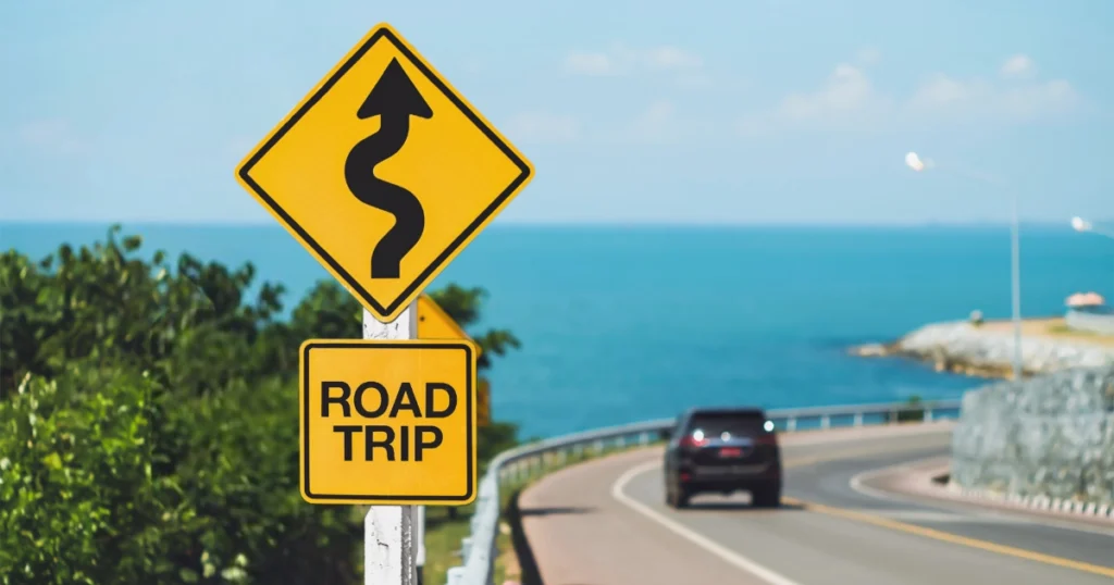 Car traveling on a summertime road trip