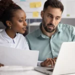 Couple comparing month-to-month coverage to term coverage