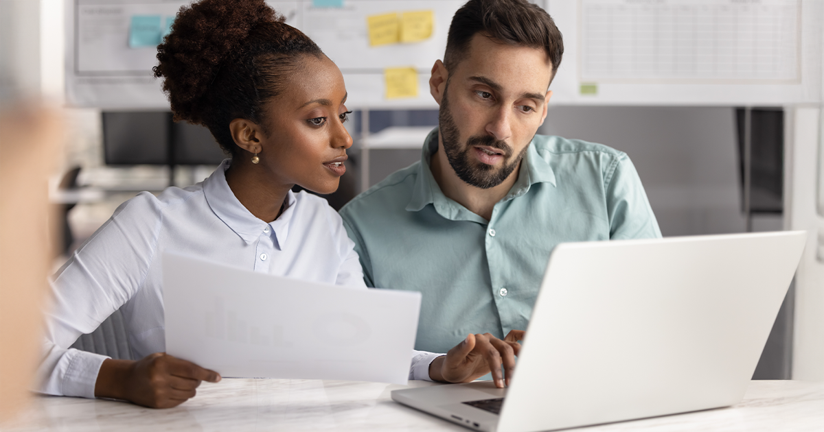 Couple comparing month-to-month coverage to term coverage
