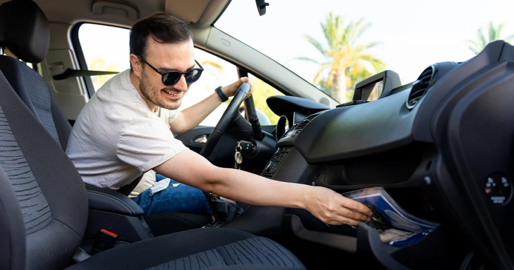 Glove box folder with documents to keep in your car, including registration and insurance