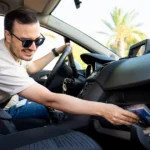 Glove box folder with documents to keep in your car, including registration and insurance